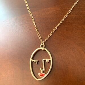 Hollow Gold Abstract Face Pendant Necklace with Red Lip Detail